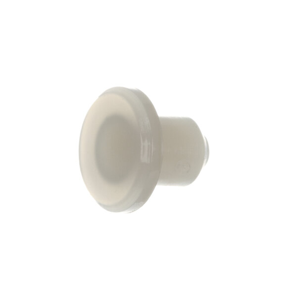 A close-up of a white plastic knob with a round center.