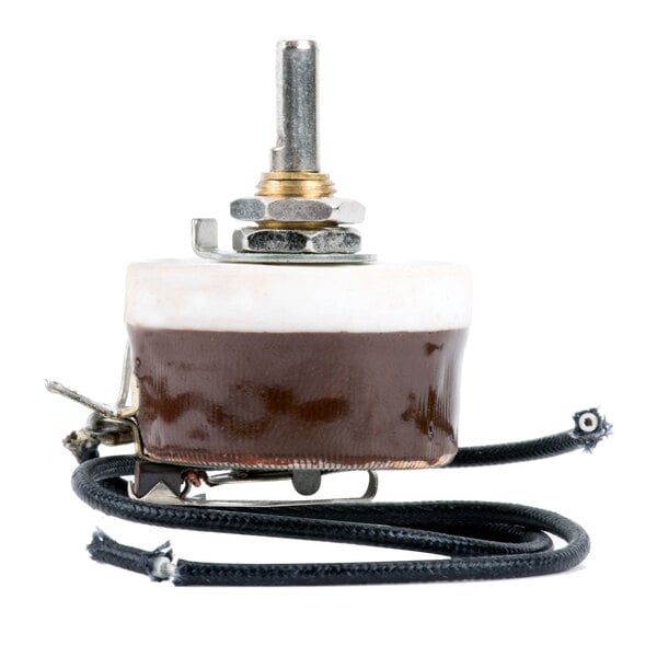 A close-up of a brown and white electrical switch with a black cord on a white background.