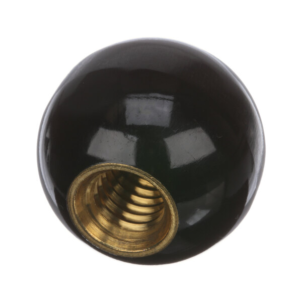 A close-up of a black and gold Hobart knob.