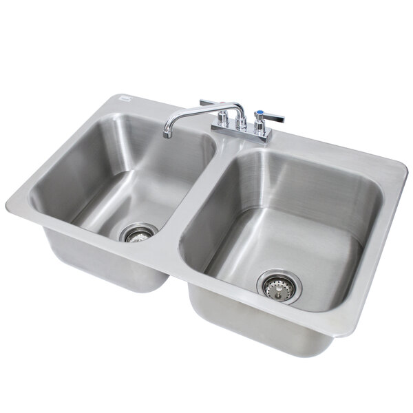 A stainless steel Advance Tabco double sink with two faucets.