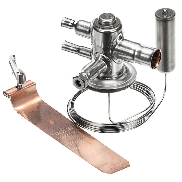 A metal device with copper pipes and a metal handle.