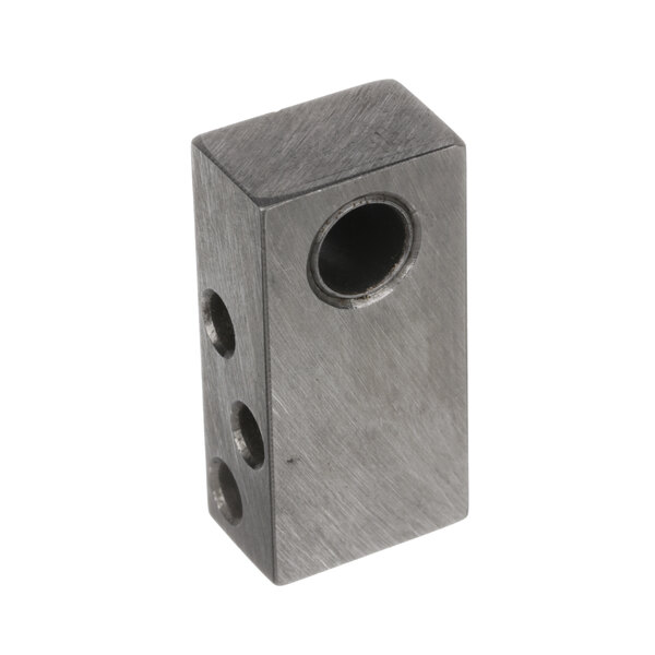 A metal block with a circular hole in it.