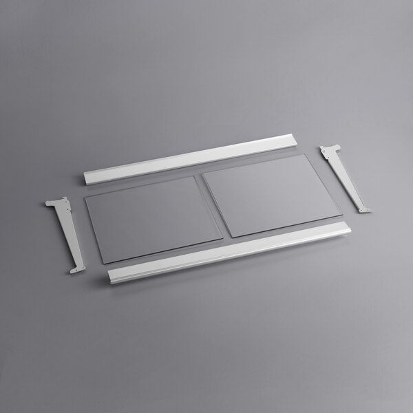 A white metal frame with metal corners and a grey rectangular bottom shelf.