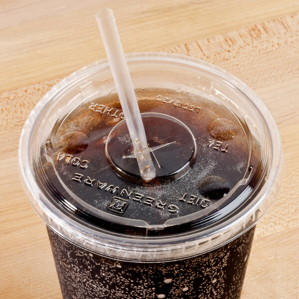 A Fabri-Kal Greenware plastic lid with a straw slot on a plastic cup with a straw in it.