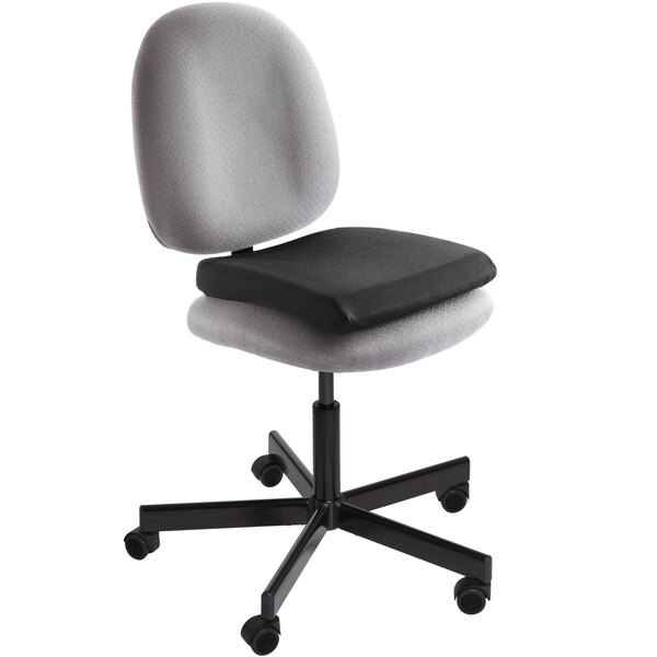 A black and grey office chair with a Kensington black memory foam seat rest.