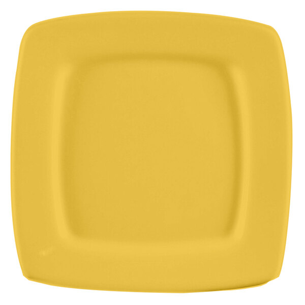 A yellow square stoneware plate with a square edge.