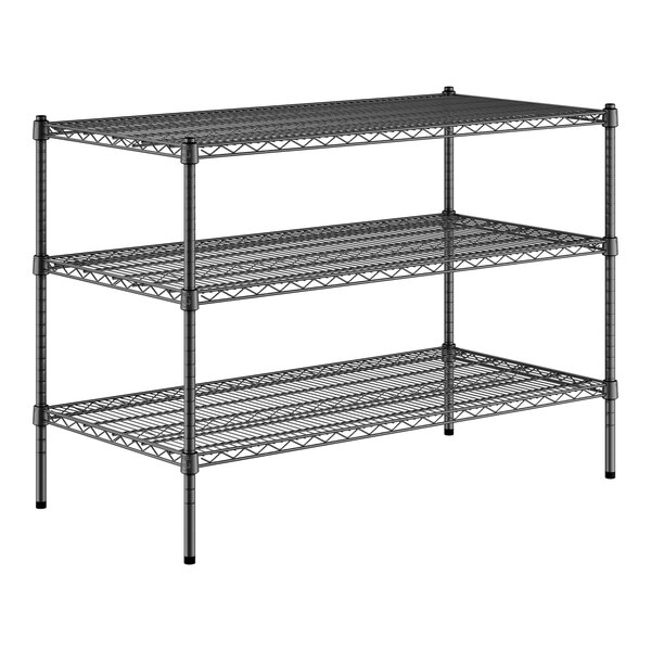 A black metal Regency wire shelving unit with three shelves.