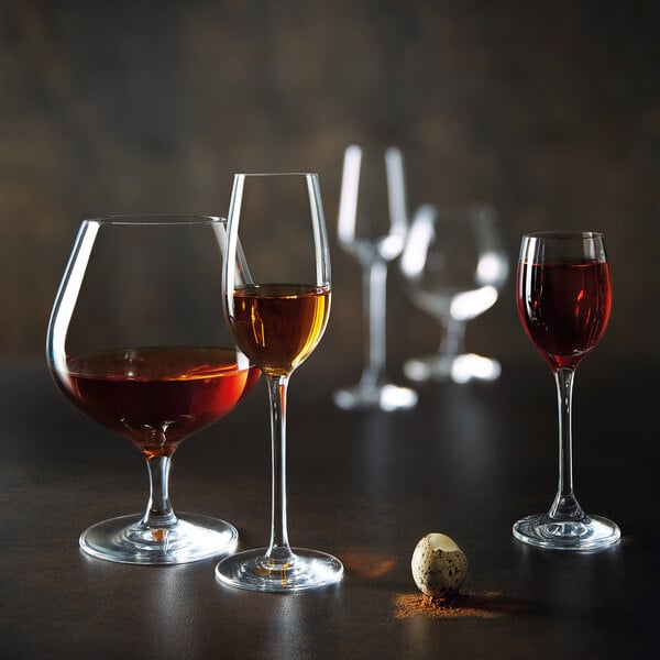 A group of Chef & Sommelier cordial wine glasses on a table.