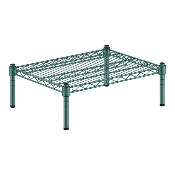 A green wire shelf with black legs.