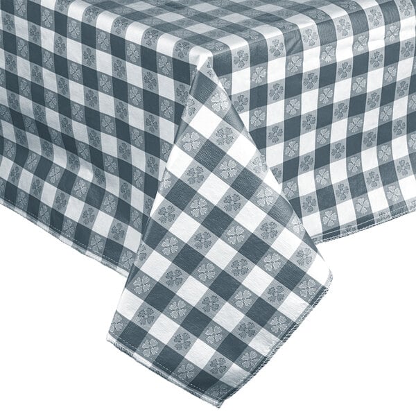 An Intedge blue gingham vinyl table cover with a checkered pattern on a table.