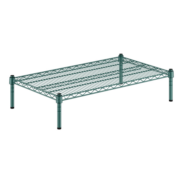 A green wire shelf with black legs.