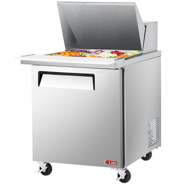 A Turbo Air stainless steel refrigerated salad prep table with a lid open.