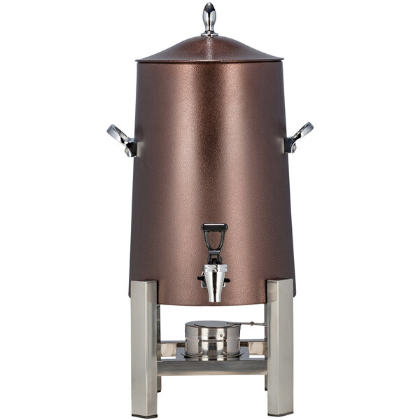 A stainless steel Bon Chef coffee chafer urn with a silver lid and copper accents.