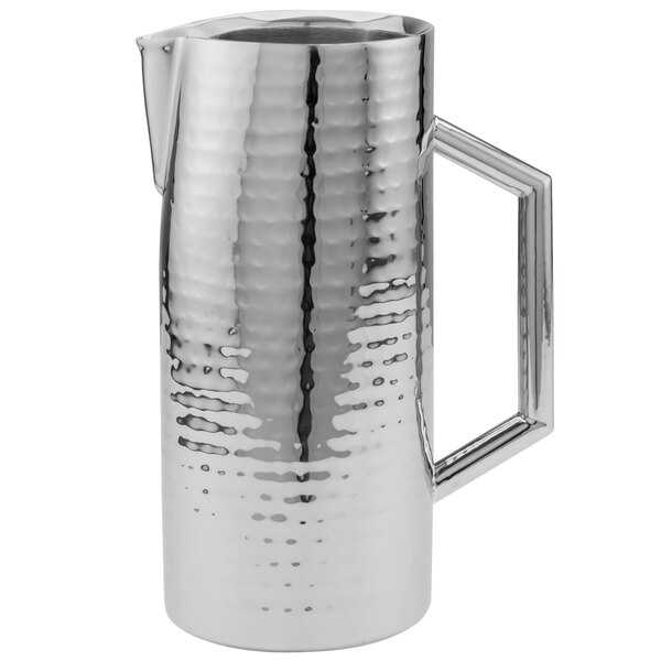 A silver Walco stainless steel pitcher with a handle.