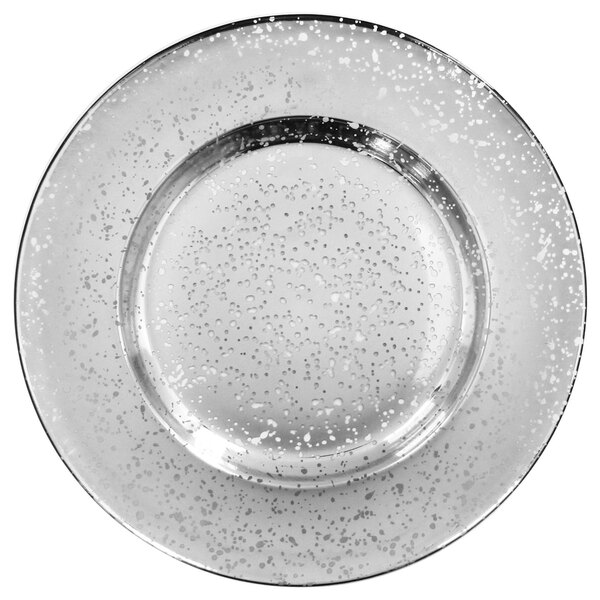A clear glass charger plate with a silver speckled surface.
