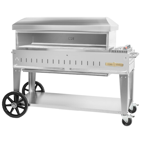 A silver Crown Verity mobile outdoor pizza oven with wheels.