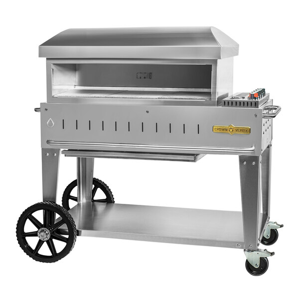 A stainless steel mobile Crown Verity outdoor pizza oven with wheels.