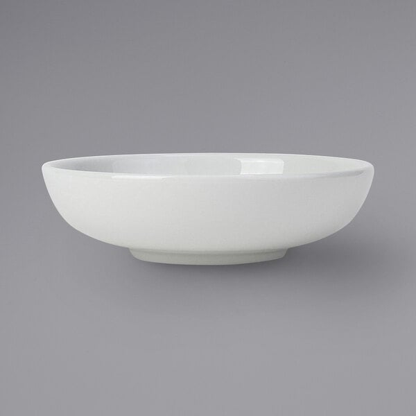 A Tuxton porcelain white pasta/salad bowl.