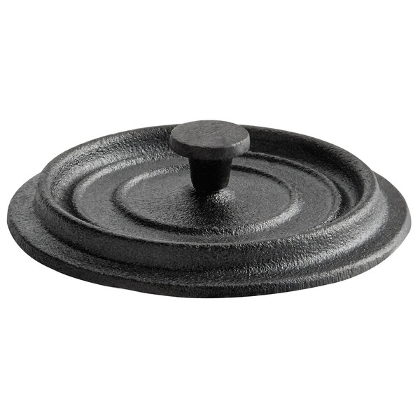 A black round lid with a round handle.