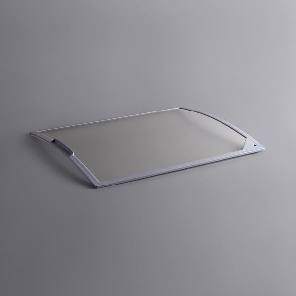 A rectangular glass lid with a metal handle.