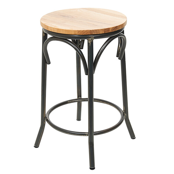 A black metal BFM Seating backless bar stool with a round wood seat.