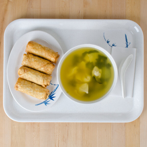 A blue bamboo Thunder Group melamine tray with a plate of food and a bowl of soup on it.
