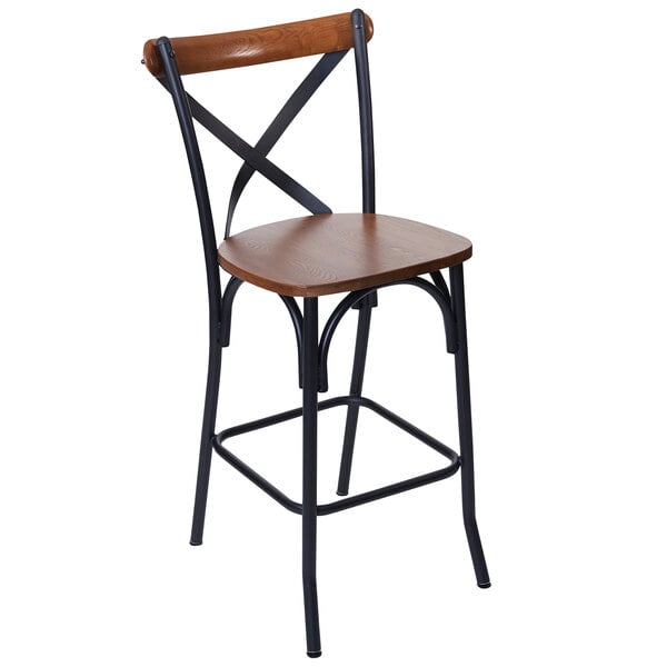 A BFM Seating Henry sand black steel bar stool with a wooden X-back and seat.