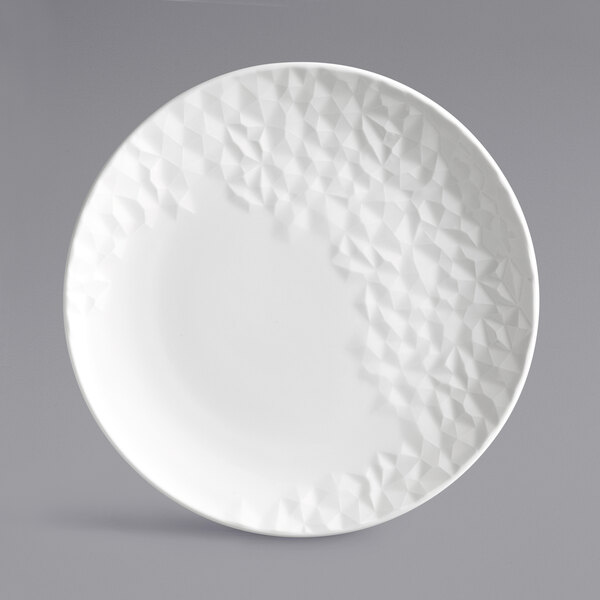 A white plate with a textured pattern.
