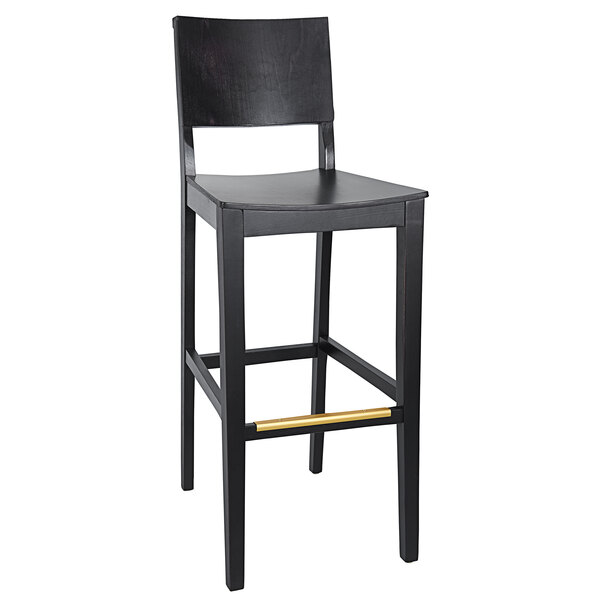 A black BFM Seating Dover beechwood barstool with a wooden seat.