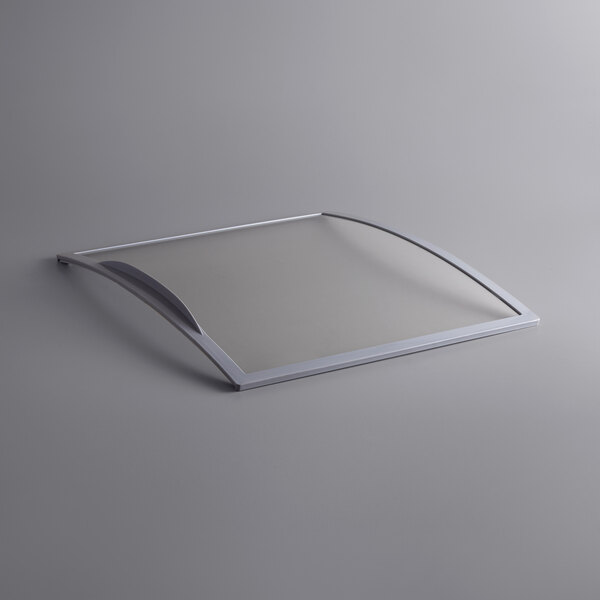 A silver rectangular glass lid with a clear window.
