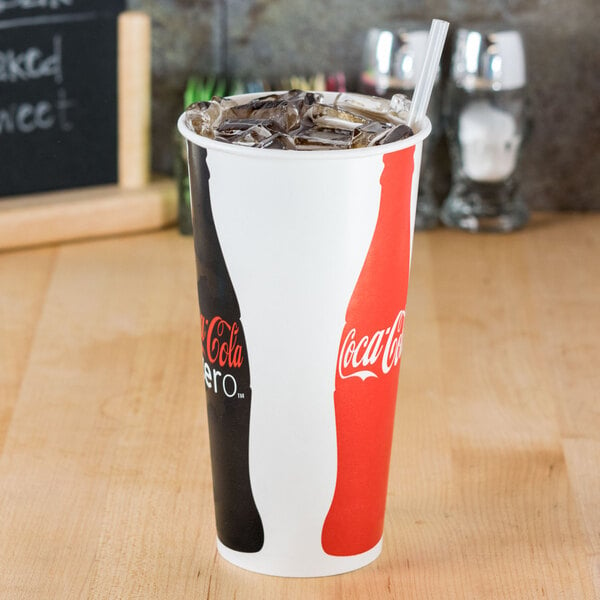A Solo Coke paper cold cup with a straw in it.