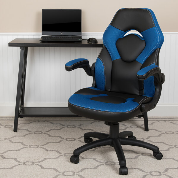 A black and blue Flash Furniture office chair with a laptop on the table.