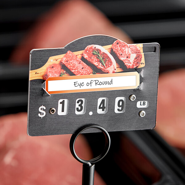 A Choice Butcher deli tag wheel with a price tag on meat.