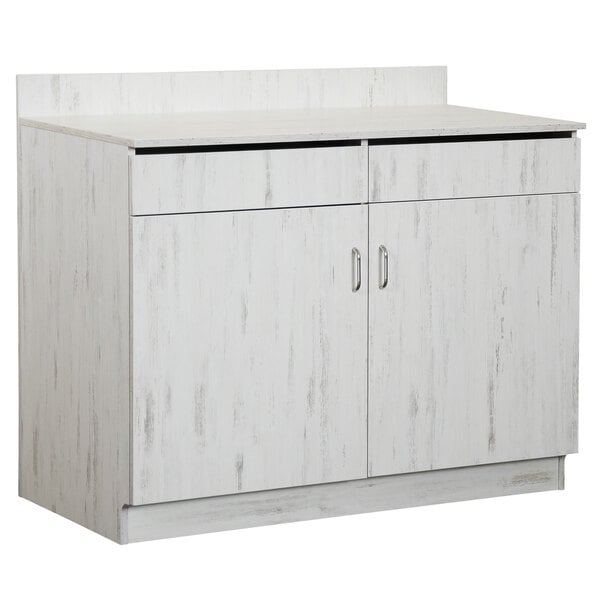 A white cabinet with two doors and two drawers.