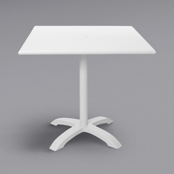 A white BFM Seating square table with a metal base.