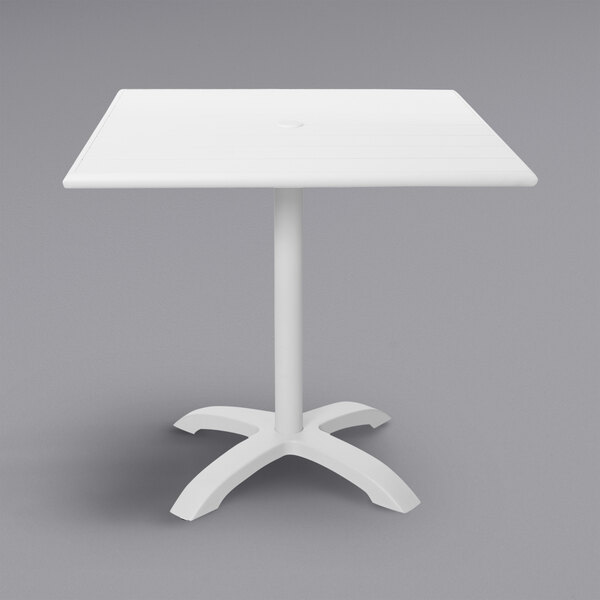 A white square BFM Seating Beachcomber-Bali table with a metal base.