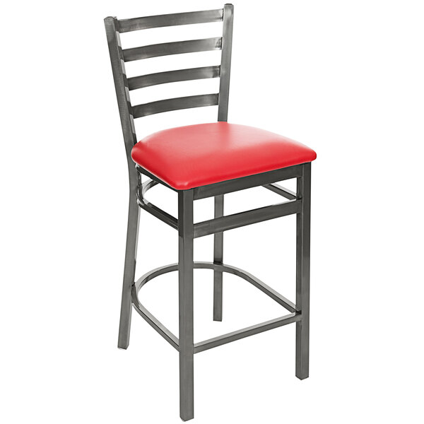 A BFM Seating clear coated steel restaurant bar stool with a red vinyl seat.