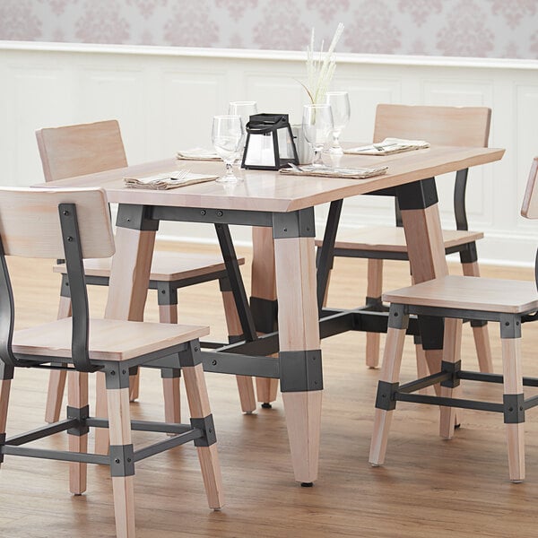 Lancaster Table & Seating wooden trestle table base for a restaurant dining table.