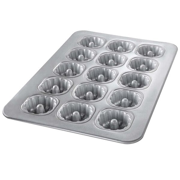 A close up of a Chicago Metallic aluminized steel mini cake pan with 15 compartments.