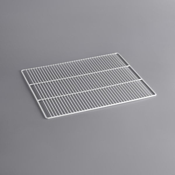 A white metal grid shelf for an Avantco Deli Case on a gray surface.