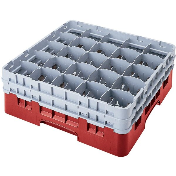 A red and white plastic Cambro glass rack with compartments and extenders.