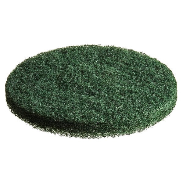 A green circular MotorScrubber scrubbing pad on a white background.