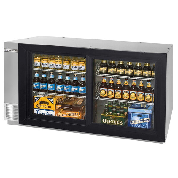 A Beverage-Air stainless steel sliding glass door back bar refrigerator filled with bottles of beer.