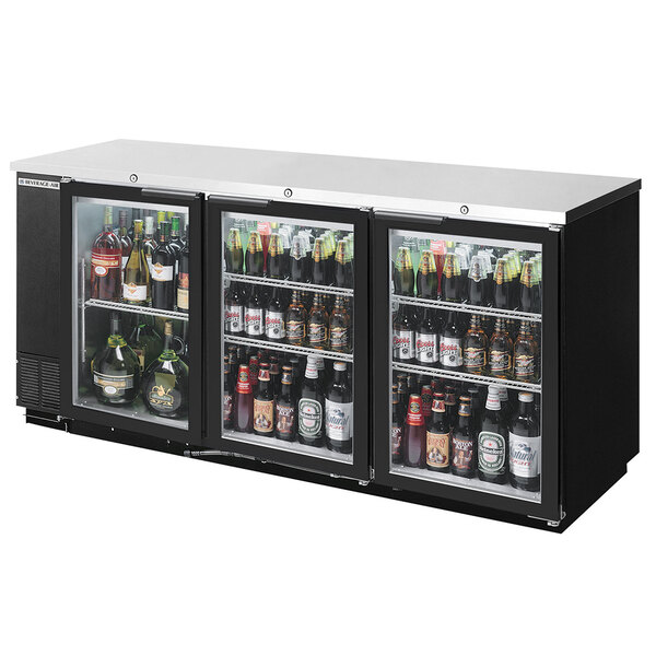 A black Beverage-Air back bar wine refrigerator with bottles of beer inside.
