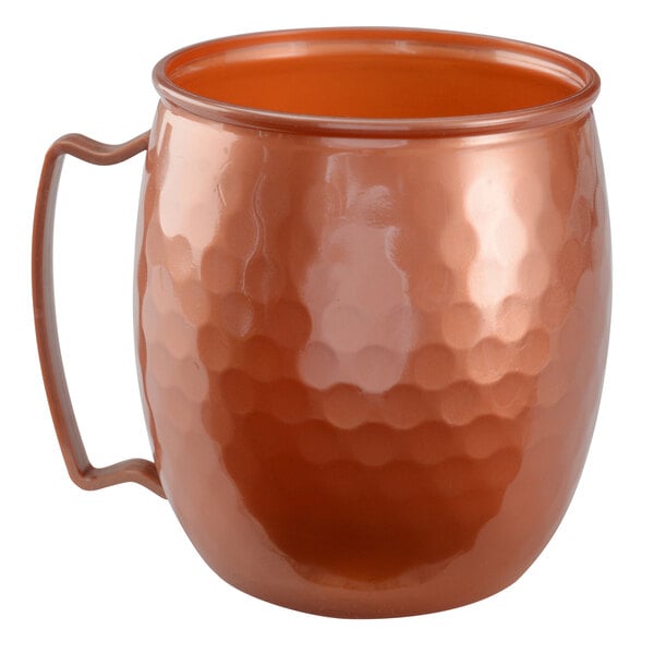 A copper mug with a handle.