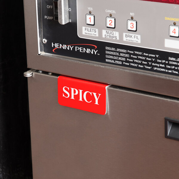 The red and white tin label for a Cawley Spicy Fryer.