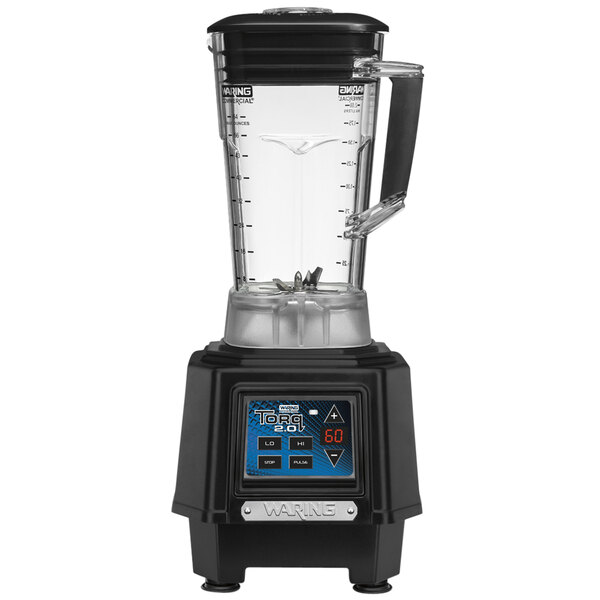 A black and silver Waring commercial blender with a clear container on a counter.