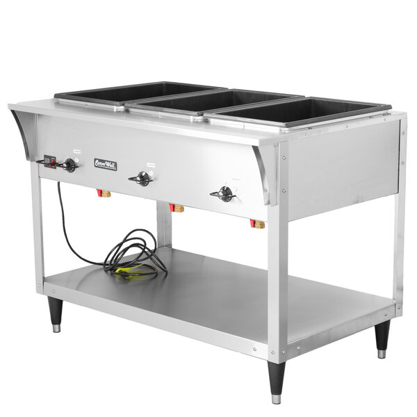 A Vollrath stainless steel electric hot food table with three pans on it.
