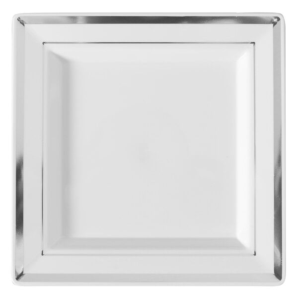 A white square plate with silver trim.