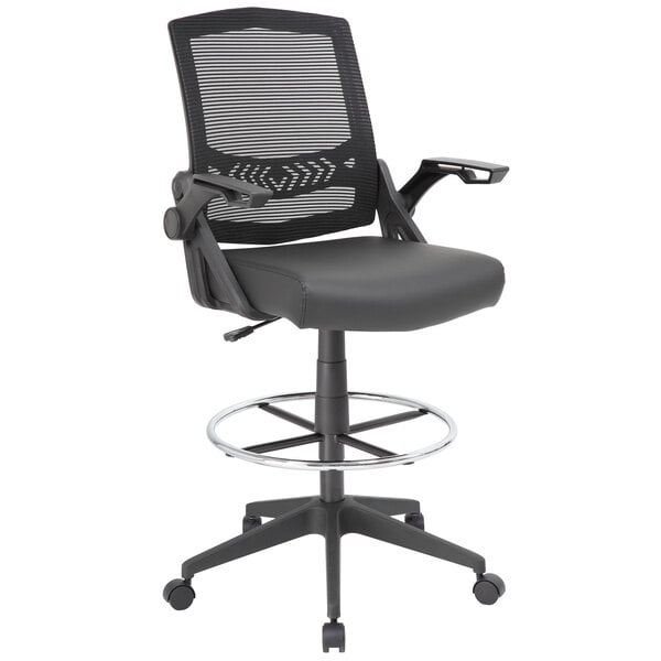 A Boss black mesh drafting stool with flip arms and a metal base.